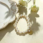 close up of hammered gold coin texture and natural rice pearls on Loxun gardener bracelet