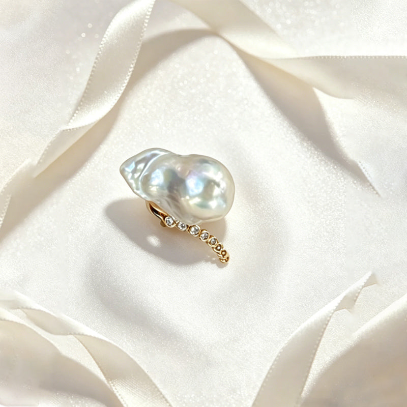 close up of natural baroque keshi pearl extreme luster and rainbow overtone on Loxun ring