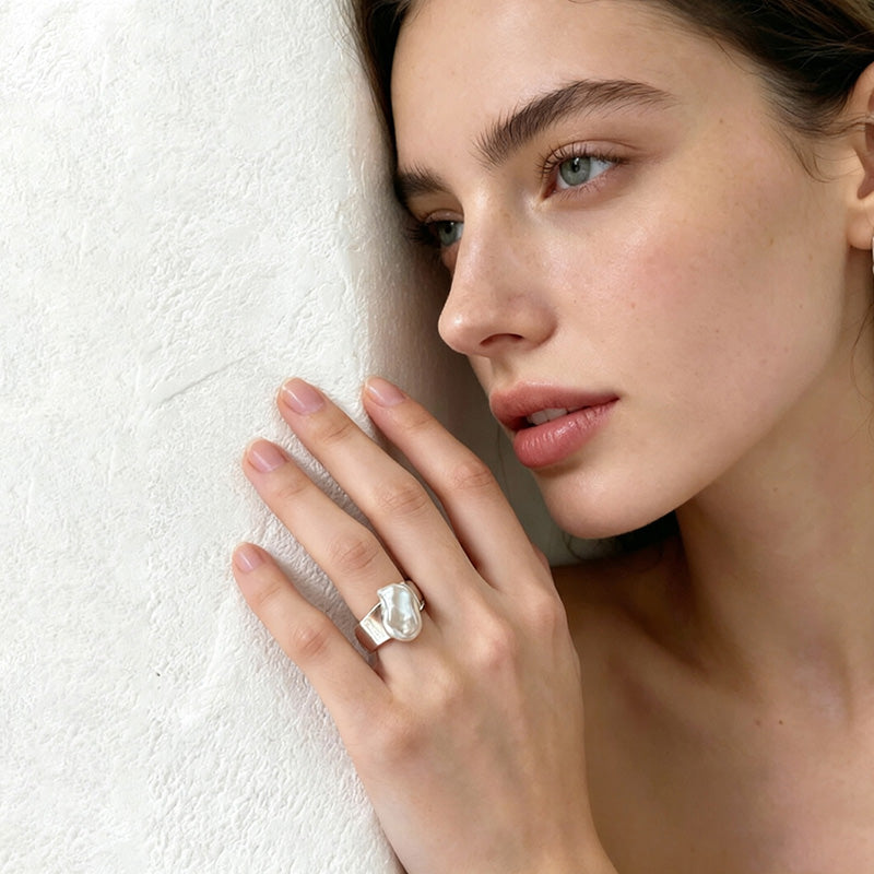 woman wearing adjustable keshi pearl ring on finger sterling silver natural pearl