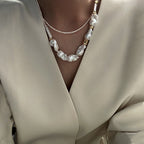 Loxun layered baroque pearl necklace stacked with a gold chain and other pearls layered effortless style