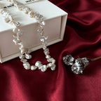 
close up of natural keshi baroque pearl irregular petal shape and soft rainbow luster on Loxun necklace
