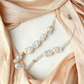close up of natural keshi baroque pearl texture and gold silver mixed metal spacers on Loxun necklace