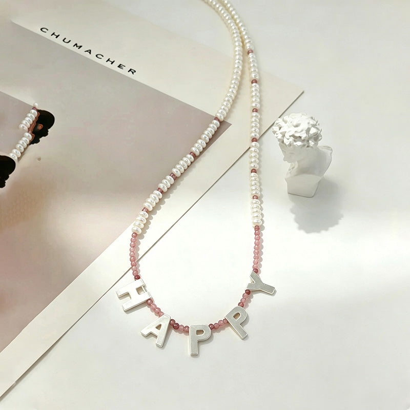 close up of Loxun custom happy necklace 925 sterling silver letter charm personalized jewelry