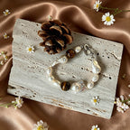 close up of natural tiger eye stripes and baroque keshi pearl luster on Loxun necklace