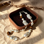 close up of natural tiger eye stripes and baroque keshi pearl luster on Loxun necklace