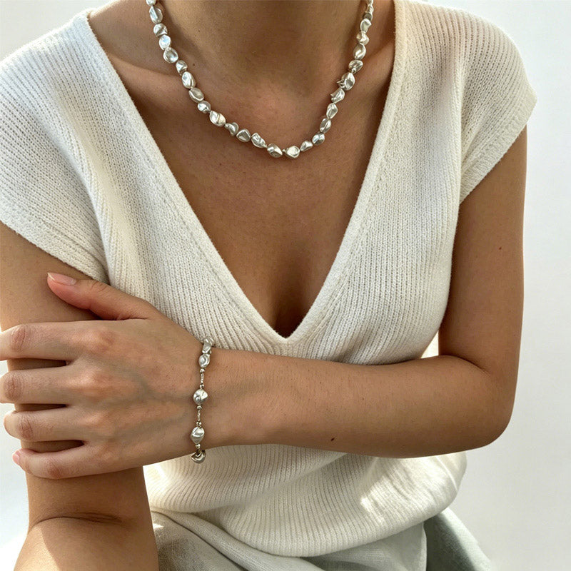 woman wearing Loxun crushed silver bead necklace adjustable sterling silver minimalist jewelry