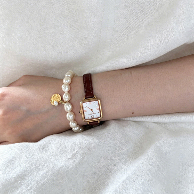woman wearing Loxun gardener rice pearl  bracelet with gold coin on wrist S/M size