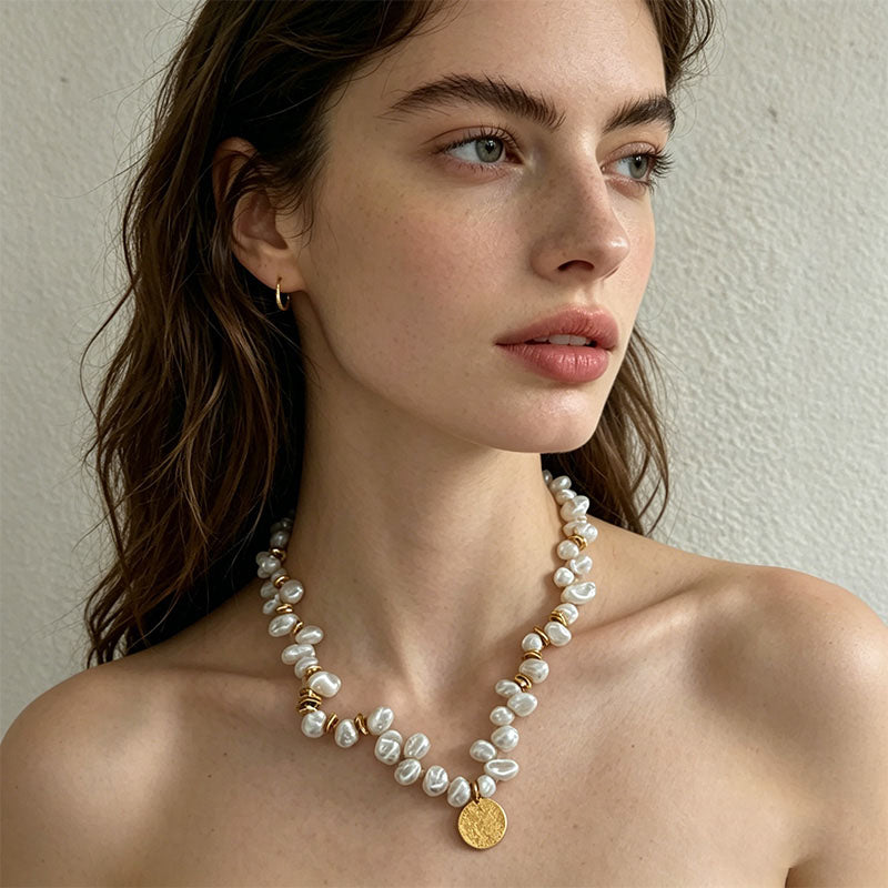 woman wearing Loxun gold medal keshi pearl necklace on collarbone 42cm choker length