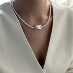 woman wearing Loxun layered pearl necklace center keshi baroque pearl on collarbone 38+5cm choker